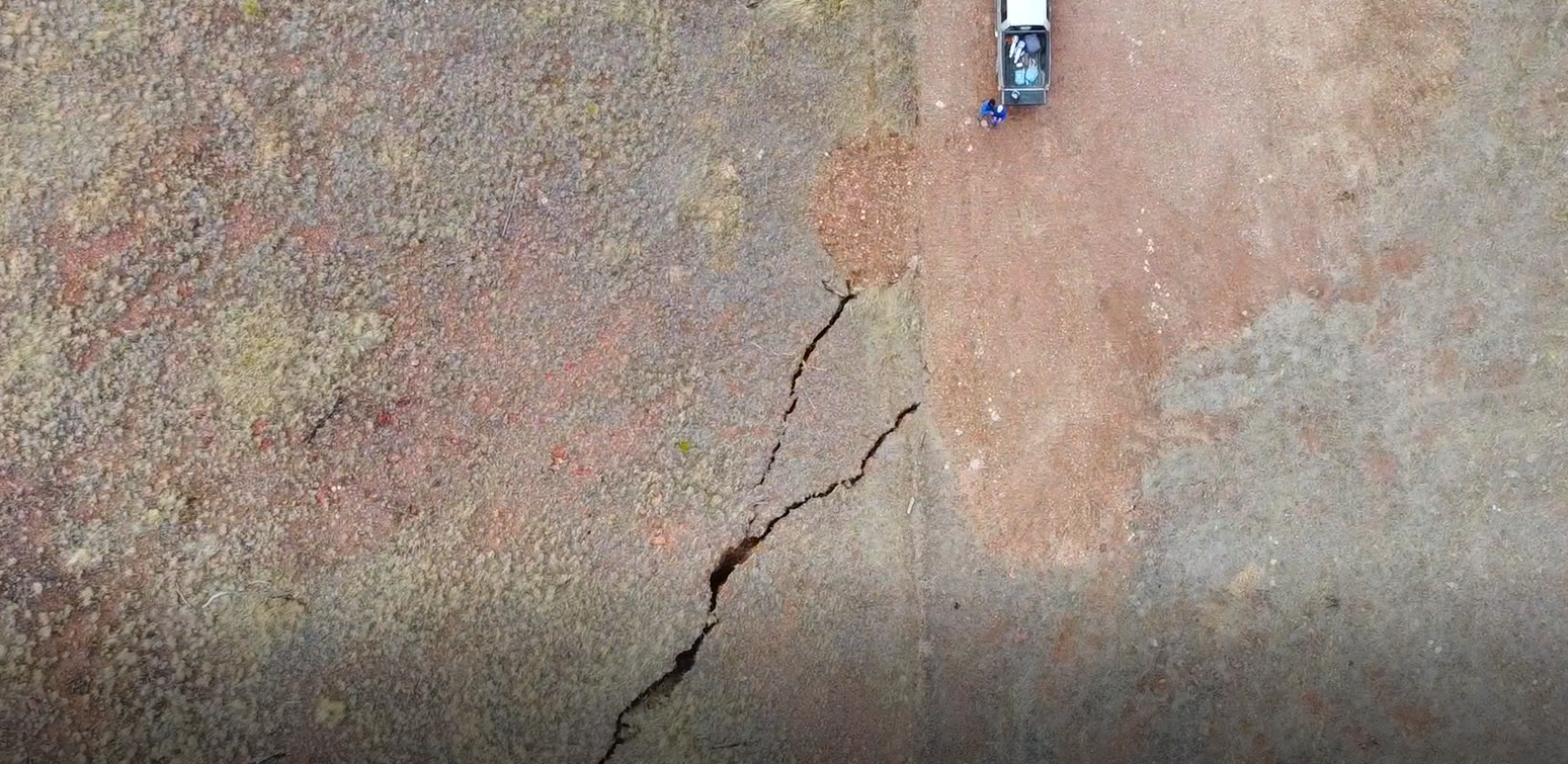 Figure 5. Aerial view of subsidence cracks repaired on the right side (2 Lazy E Ranch, Sec. 22, T7N, R27E), unrepaired on the left side (My Green Earth, Sec. 27, T7N, R27E (November 4, 2022)